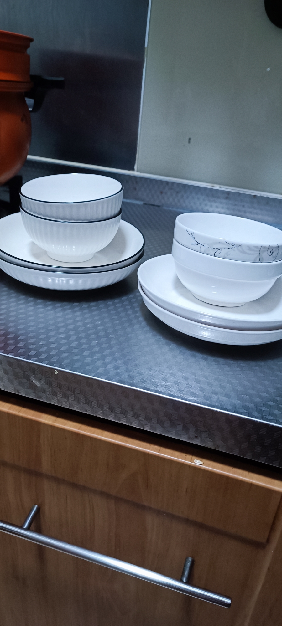 Two sets plates and bowls